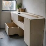 Built-in cabinets with doors and shelves fitted into a home interior